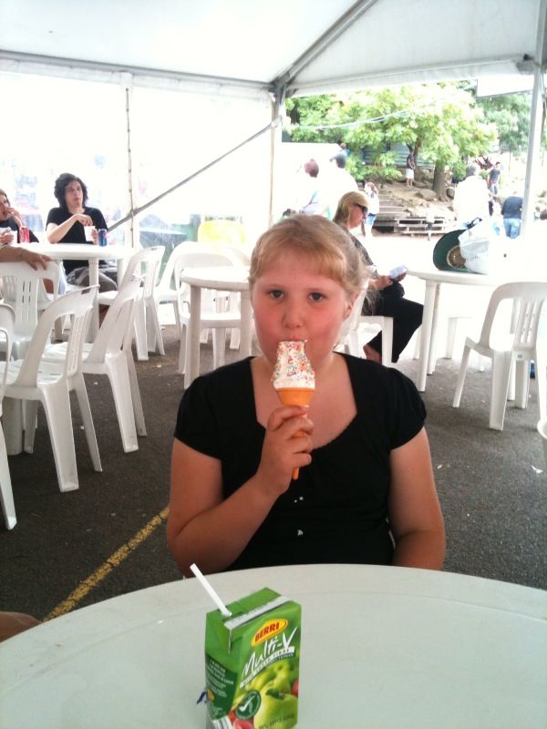 Ella eating ice-cream at the Ivanhoe fair